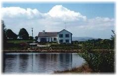The Waterfront House Country Home - viewed from the lake - with the hills of Connemara in the background