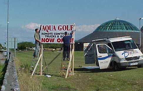 John & Mike of D-Signs busily erecting the Aqua Golf Signs outside the Aqua Dome on Tuesday before the official opening
