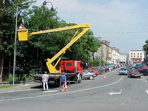 Busy erecting the Festival lights in Denny Street 
on Sunday 23rd July.